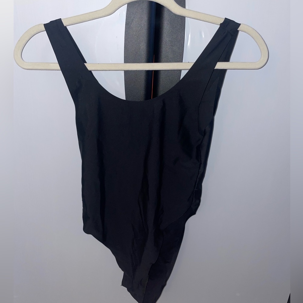 Plain black bodysuit. So flattering!!